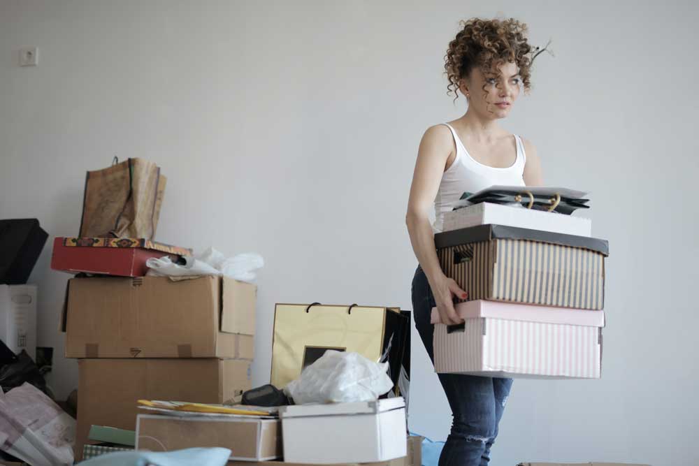 Woman packing moving boxes