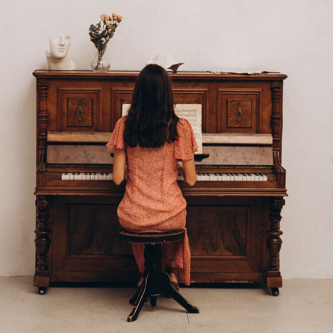 Lady sitting at piano